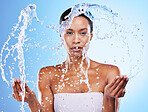 Clean, beauty and water splash with black woman in shower and grooming portrait against blue studio background. Hygiene, fresh and water with splash for cleaning and washing with hydration.