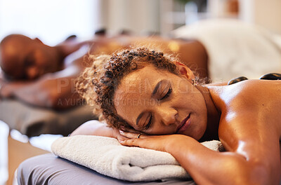 Buy stock photo Spa, couple getting massage and wellness, hot stone massage and body therapy for health and stress relief. Relax, calm and peace with zen and body care, treatment and luxury service for self care.