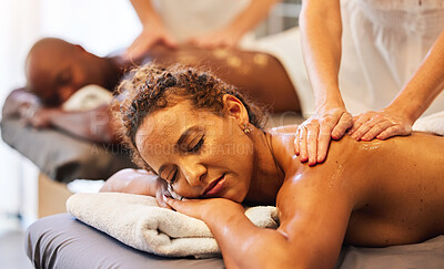 Buy stock photo Black couple massage, spa and relax with oil on vacation, holiday or retreat together for bonding, honeymoon or calm. Black woman, man or couple in massage therapy service, health or luxury wellness