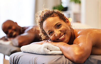 Buy stock photo Relax, happy and love with black couple in spa for massage, luxury and zen together. Peace, smile and therapy with man and woman in wellness salon table for beauty, calm and skincare treatment