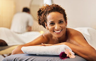 Buy stock photo Black woman, smile and relax in massage at spa for cosmetic skincare or beauty treatment at a resort. Portrait of African American female lying on massaging table or bed smiling for luxury wellness