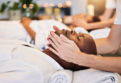 Buy stock photo Face massage, beauty therapist and black man, skincare and relax in luxury spa with zen, hands and rest on a bed. Wellness, skin health and cosmetic treatment for healthy skin and relaxing body