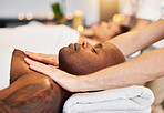 Massage, spa and black man with therapist hands, relax and skincare with zen, peace and wellness on bed. Physical therapy, healing and body therapy, relaxing and luxury treatment with therapist hand