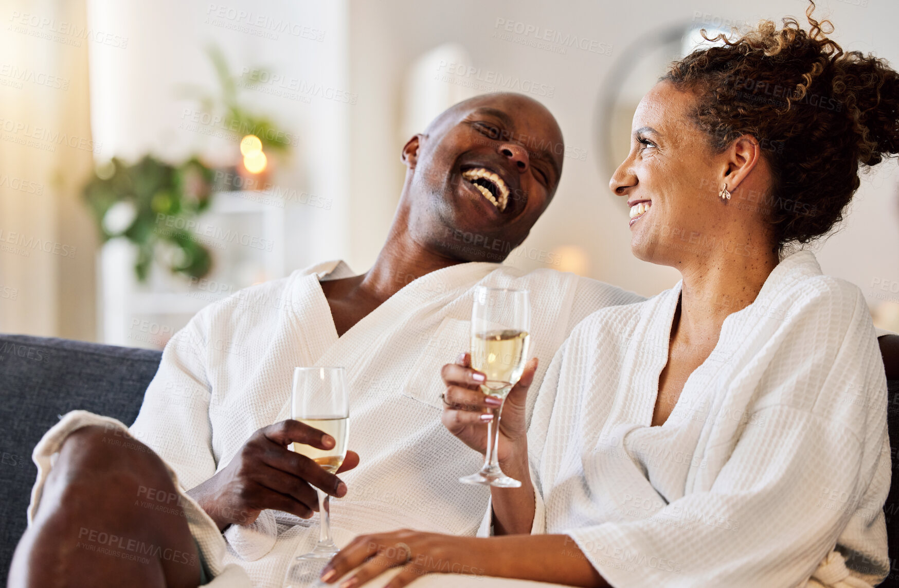 Buy stock photo Love, couple and wine at hotel on vacation, holiday or honeymoon trip. Romance, luxury champagne and interracial couple, man and woman drinking alcohol, talking and enjoying quality time together.