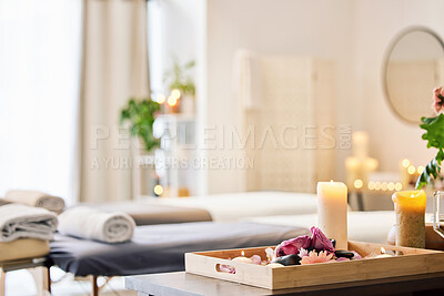 Buy stock photo Candle, spa and relax with aromatherapy treatment in a tray in a room for luxury or wellness. Background, health and massage with still life in an empty resort for peace, skincare or relaxation