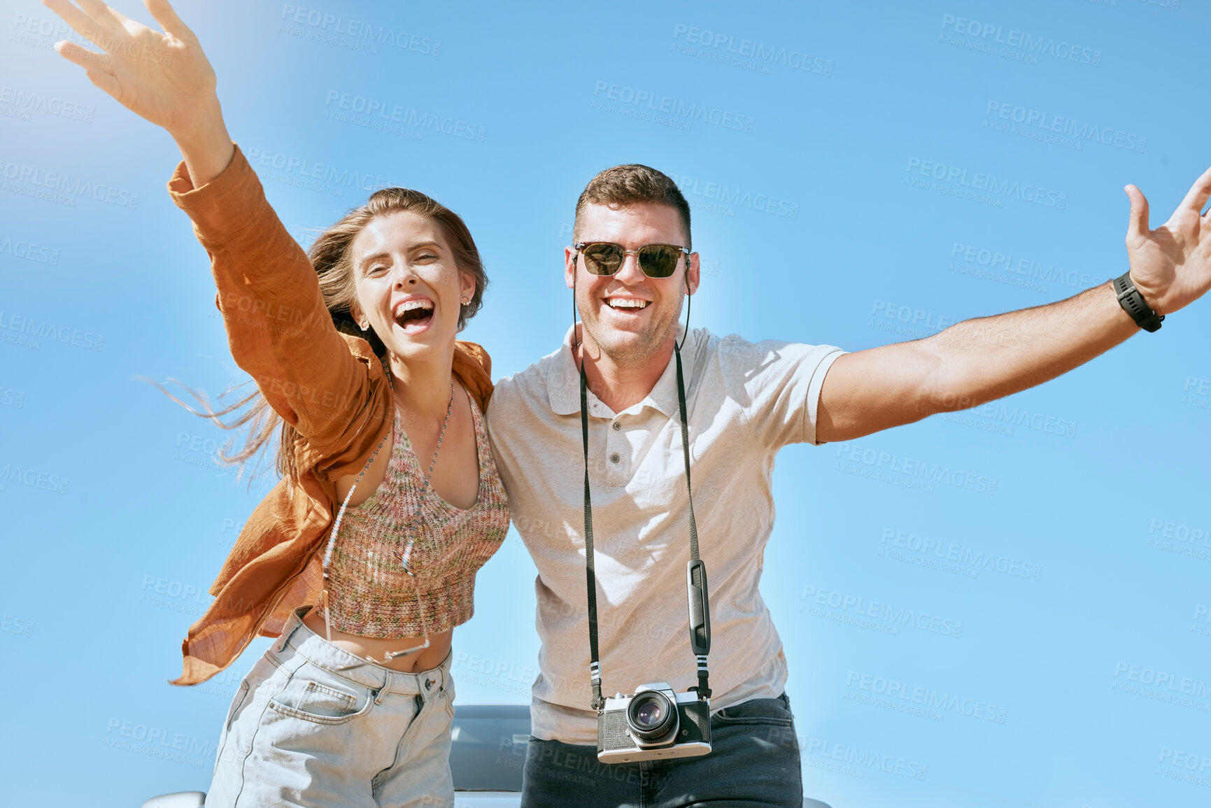 Buy stock photo Happy, couple and travel with freedom, love and vacation adventure together having a fun. Portrait of happy couple in nature on holiday journey with free, relax and happiness feeling in summer sky