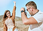 Camera photographer, couple and nature vacation, holiday or summer trip. Love, travel and happy man taking pictures of woman, partner or lover, having fun or enjoying quality time together outdoors.