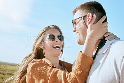 Buy stock photo Couple, travel and hug on a vacation adventure laughing on a walk outdoor in summer. Sunglasses, smile and love of a happy couple together with a funny, happiness and fun time in nature walking