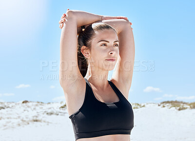 Buy stock photo Beach, workout and arm stretching of a woman training in nature before running or yoga. Fitness, healthy and runner person outdoor relax in the sun after outdoor exercise, sport and wellness activity