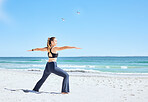 Woman on beach, yoga and pilates exercise by the ocean in summer sun for health fitness, flexibility and vitality. Zen stretching, workout on sea sand and self care training for mental health balance