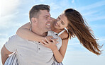 Love, blue sky and bonding couple hug while on honeymoon  vacation date for romance, quality time or outdoor freedom. Peace, trust partnership and fun marriage people play piggyback in Toronto Canada