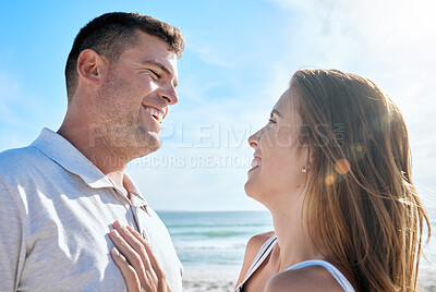 Buy stock photo Smile, love and couple at the beach while on holiday or romantic summer honeymoon in greece. Happy, care and calm man and woman with romance, embracing and bonding in nature by the ocean on vacation