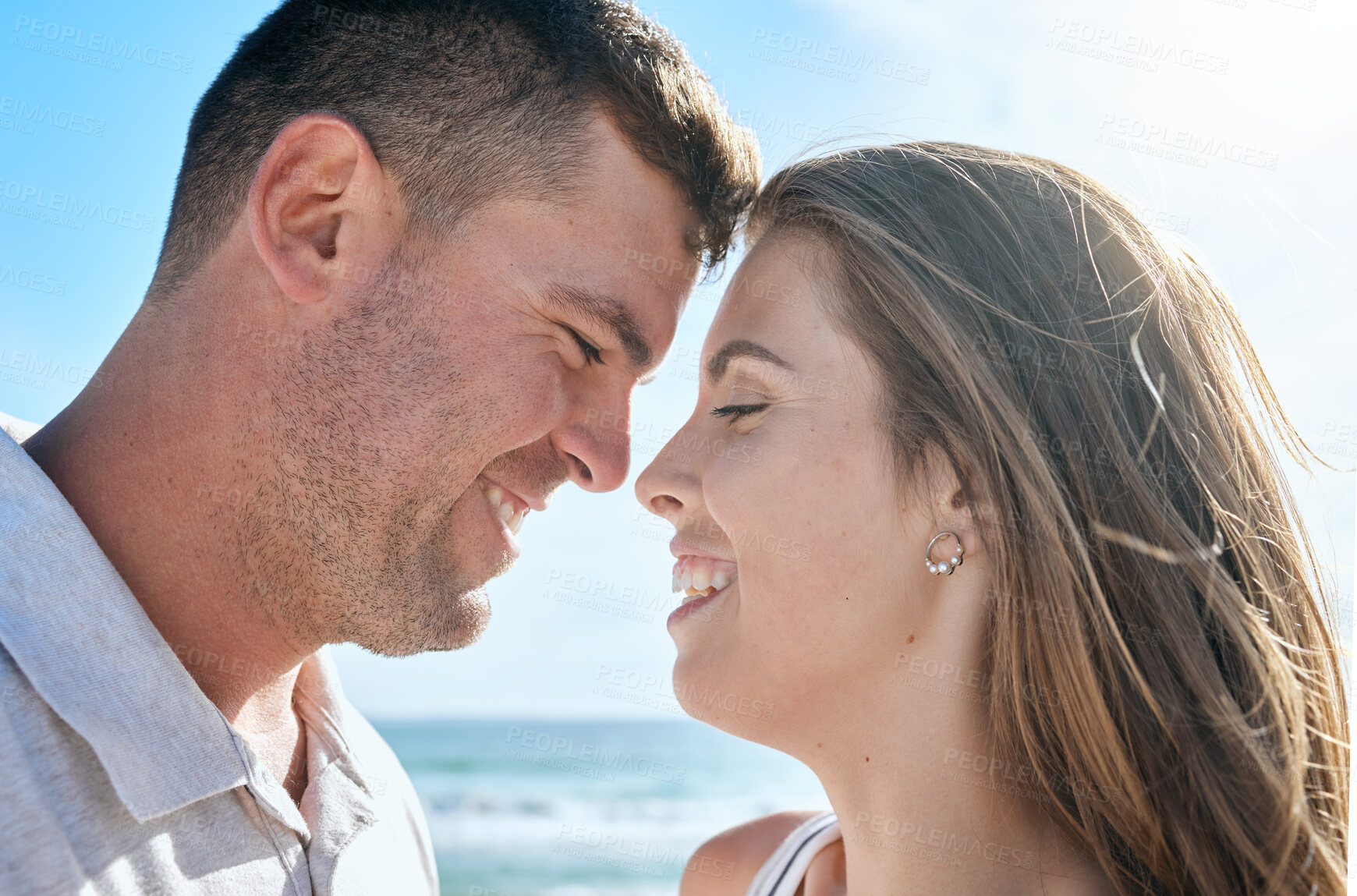 Buy stock photo Couple, love and happy smile at beach, holiday and anniversary travel in summer with romance in Ibiza. Young man and woman enjoy marriage, happiness and content together outdoor at a ocean vacation