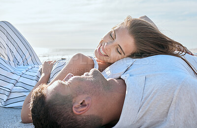 Buy stock photo Happy couple relax on beach, woman with smile and summer love in Portugal sunshine on holiday together. Marriage happiness, seaside date in outdoor ocean vacation and girlfriend laying on man's chest