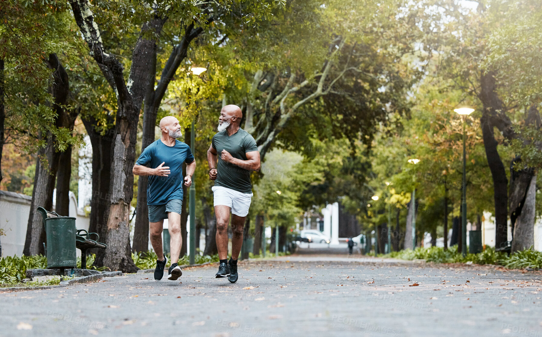 Buy stock photo Fitness, friends and senior men running in road of city for health, wellness and body care. Exercise, training and elderly males run together enjoy being active, workout and exercising in retirement