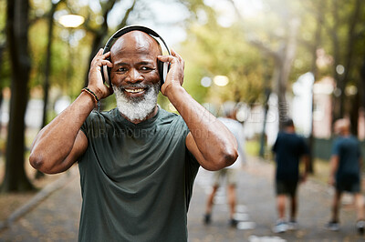 Buy stock photo Fitness, headphone and senior black man, music and exercise in nature park, portrait and running for health and wellness. Elderly runner, streaming and podcast while training, workout and run outdoor