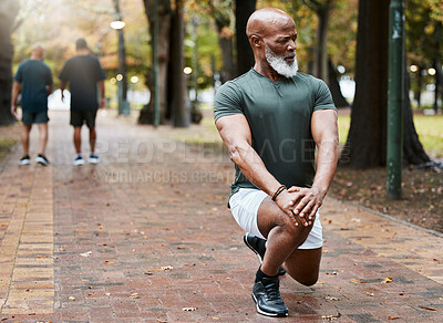 Buy stock photo Black man, fitness and stretching leg in a park for workout exercise or cardio training in the outdoors. African American male in warm up stretch for running or exercising in a natural urban town