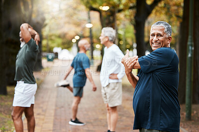 Buy stock photo Fitness, exercise and stretching with a senior man getting ready for a workout or training outdoor at the park. Health, wellness and performance with elderly male at the start of his routine in group
