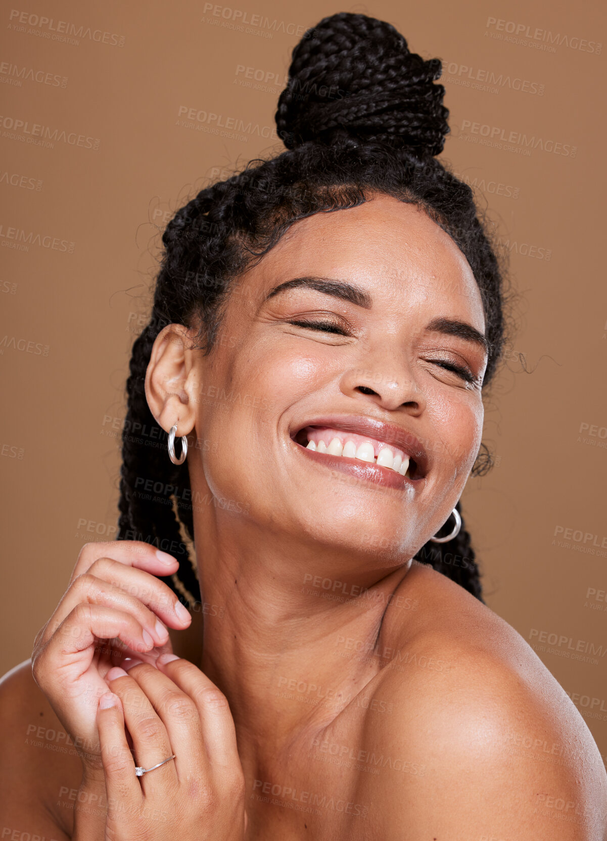 Buy stock photo Skincare, wellness and happy black woman in studio for a health, cosmetic and natural skin routine. Beauty, happiness and African model with cosmetics, makeup or facial treatment by brown background.