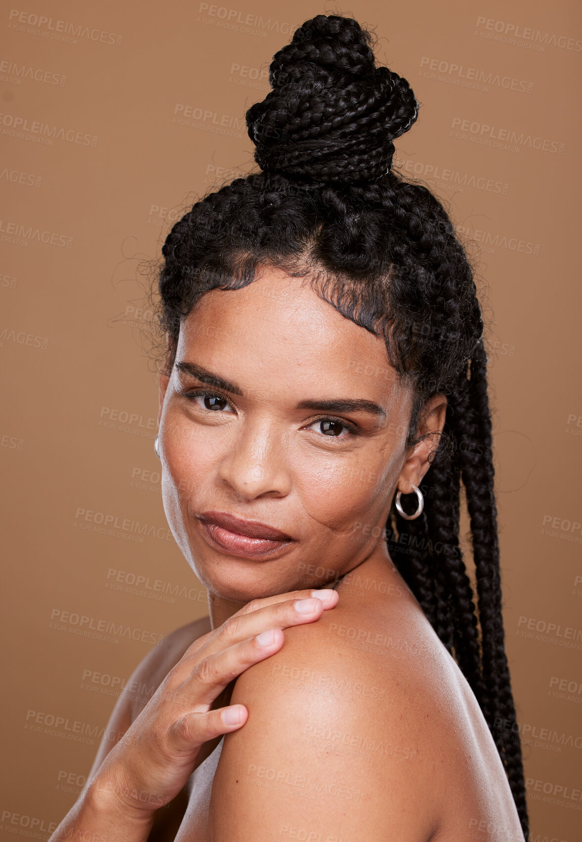Buy stock photo Woman, beauty and portrait of black woman with braids for skincare, facial treatment and health or wellness. Beautiful female, luxury skin care and bodycare on a brown studio background