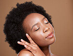 Black woman, eyes close and beauty studio for skincare, cosmetics or wellness by brown backdrop. Radiant African model, glow or healthy skin for natural makeup, happy or cosmetic shine by background