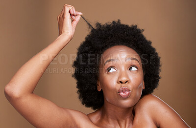 Buy stock photo Black woman, afro and face for hair care health and beauty or curly hair wellness in studio. African girl, natural cosmetics hairstyle and fun face for salon curly haircut against brown background