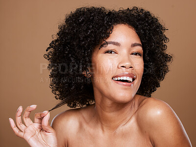 Buy stock photo Black woman, natural and curly hair wellness model for luxury cosmetics product mockup on brown wall of studio background. Happy African girl, healthy skincare beauty and afro for salon spa treatment