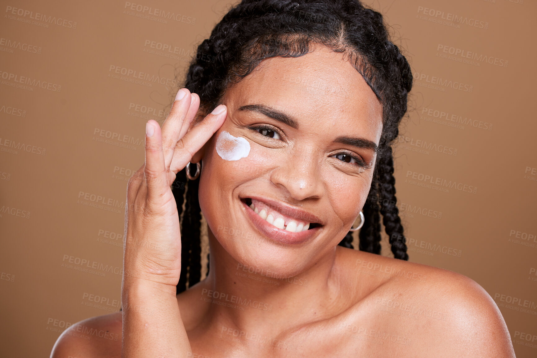 Buy stock photo Black woman, skincare beauty and face with cream product on cheeck for smooth skin, wrinkle protection creme and cosmetics empowerment.  Portrait of happy, confident smile and organic lotion mockup 
