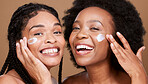 Black women, facial cream and skincare of friends or beauty model with face lotion and skin wellness. Portrait of black women with a smile with body cosmetics, sunscreen and healthy self care glow 