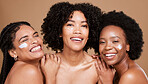 Beauty skincare, friends and black women with face cream in studio for moisturizing on brown background. Portrait, smile and group of models with facial lotion or cosmetics product for healthy skin.