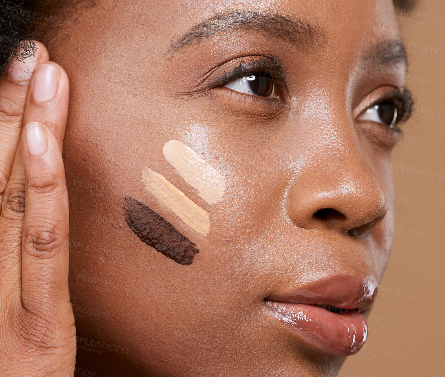 Buy stock photo Beauty, makeup and foundation shades on face of black woman with swatch for cosmetics, diversity or base tone. Visage, product and glamour with different color on girl model for concealer or textures