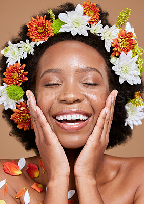 Buy stock photo Flowers, beauty and black woman with smile, happy and skincare plants in brown studio background. Spring, healthy skin and nature girl model with flower, face and advertising facial cosmetic product