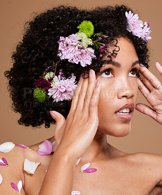 Buy stock photo Flowers, skincare and woman in studio for beauty, skin and facial by nature, plant and product on brown background. Flower, crown and black woman and floral aesthetic for wellness, cosmetic and zen  