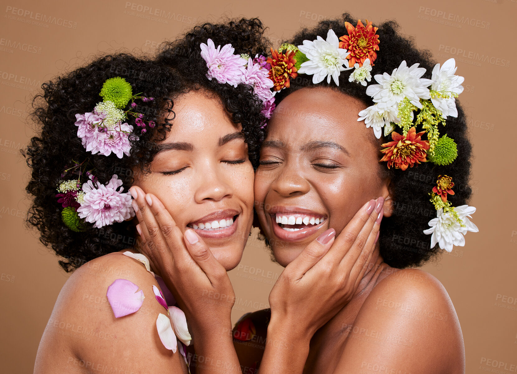 Buy stock photo Flower, skincare and African women with support for wellness from dermatology against a brown studio background. Beauty, care and floral model friends with love for flowers and cosmetics with a hug