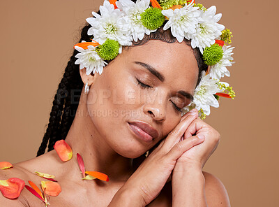 Buy stock photo Beauty, skincare and flowers in hair of black woman for natural, spring and luxury cosmetics. Wellness, relax and makeup with face of girl model for self love, fresh and creative in studio background