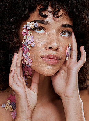 Buy stock photo Model, makeup and beauty with flower eye for cosmetics, wellness and skin art on face in studio. Black woman, facial flowers and glow skin with cosmetic, health and creative floral pattern in zoom