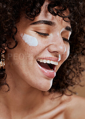 Buy stock photo Beauty, skincare and woman with face cream in a studio with a healthy, natural and skin treatment. Wellness, health and happy young model doing a face routine with facial creme, sunscreen or spf.