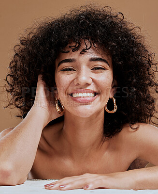 Buy stock photo Skincare, hair and natural portrait of black woman happy with beauty, smile and freckles on face. Health, wellness and curly model for hair care or facial cosmetics campaign in brown studio.