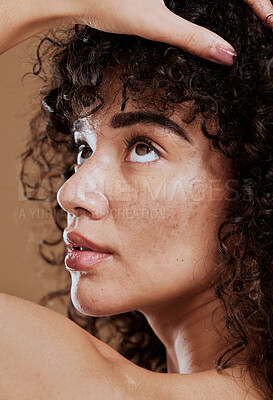 Buy stock photo Beauty, skincare and natural hair of a young woman in studio for cosmetics, makeup and hair care for health and wellness. Face glow of a female after a facial with dermatology cream for acne skin