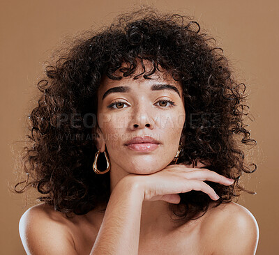 Buy stock photo Makeup, confident and portrait of a woman with hair care, skincare and beauty against a brown studio background. Face, cosmetic and young girl model with a curly afro, cosmetics and empowerment