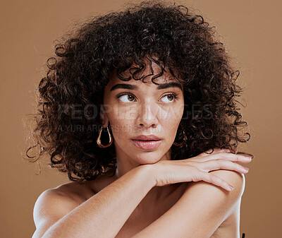 Buy stock photo Beauty, skincare and natural hair of woman in studio for cosmetics, makeup and wellness mockup on brown background. Face of an aesthetic model with a fresh glow from using dermatology facial product