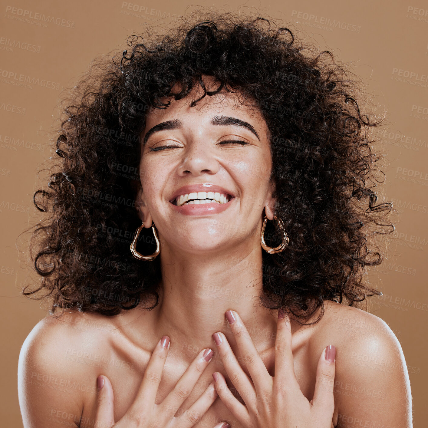 Buy stock photo Beauty, skincare and self love of a black woman with natural hair feeling happiness and pride for identity on a brown studio background. Aesthetic model happt about cosmetics, makeup and glow on skin
