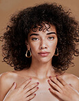 Skincare, makeup and face of a woman for wellness, health and luxury from spa against a brown studio background. Beauty, cosmetics and portrait of a young cosmetic model with hair care and glow