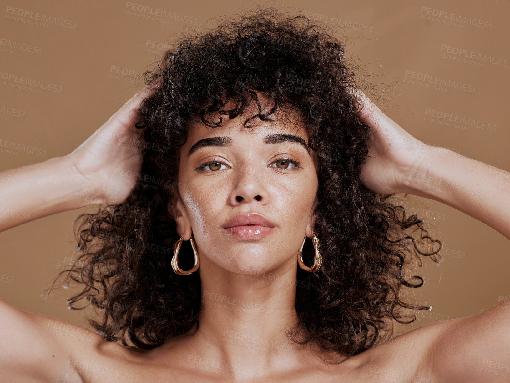 Buy stock photo Hair care, black woman and portrait with curly hair, beauty and wellness by cosmetics background. Hair, model and jewelry earrings with cosmetic skin glow with makeup, gold jewellery and radiant face