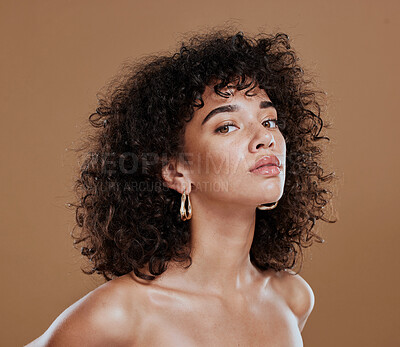 Buy stock photo Black woman, beauty and skincare face portrait for natural afro, facial or hair care cosmetics. Healthy, beautiful and assertive model with curly hair shine and texture in brown studio background.