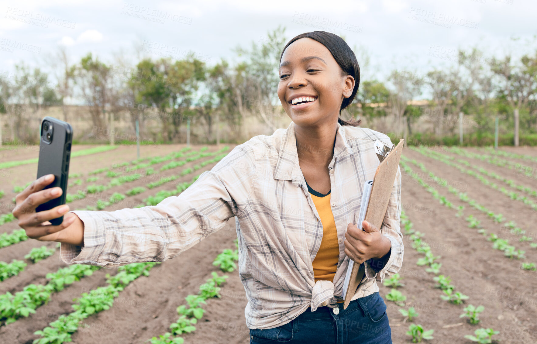 Buy stock photo Black woman, farm and agriculture selfie with farmer in harvest field for farming and sustainability outdoor. Smile in picture, smartphone and clipboard for crop check and inspection, green and soil.