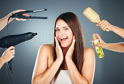 Buy stock photo Hair, tools and portrait of woman with haircare products for beauty, cosmetology and wellness on a grey studio background. Brush, hairdryer and spray for hairstyle and hair treatment in a salon