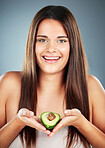 Wellness, aesthetic and portrait of avocado girl for hair care, skincare or health campaign. Natural, healthy and organic lifestyle model face with confident smile in gray studio background.