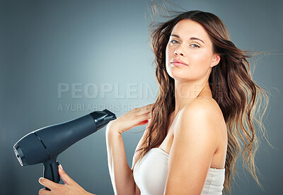 Buy stock photo Portrait, hair care and blow dryer for woman, salon natural beauty and confident on studio background. Female, girl and equipment for spa styling, casual and trendy look for aesthetic hair style