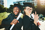 Graduation, students and happy for success, achievement or silly together outdoor. Portrait, man and woman smile, for completed degree and in gown for education, certificate and diploma at university